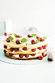 Layer cake with cream and raspberries