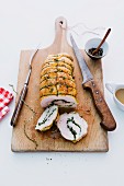 Turkey roulade filled with herbs, sliced
