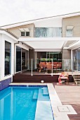 Pool next to terrace of modern, designer house