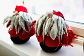 Wool and felt gnome figurines on windowsill