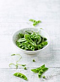 A bowl of organic pea pods