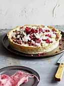 An ice cold lemon pie with pomegranate seeds