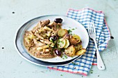 Stir-fried veal with olives and potatoes