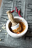 Kha curry paste in a mortar (red curry paste with galgant)