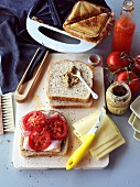 Toasted ham and cheese sandwich with tomatoes and mustard