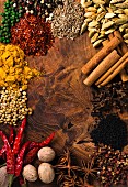 Assorted spices on wooden board