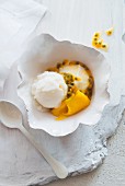 Coconut ice cream with passion fruit sauce
