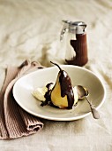 Poached Pear with Chocolate Sauce and a Scoop of Vanilla Ice Cream, Spoon
