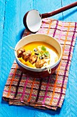 Cream of pumpkin soup with chicken skewer