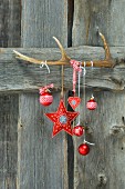 Christmas hanging from antler on wooden wall