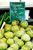 Artichokes with a price label at a market in France