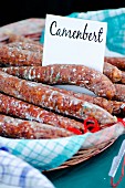 French Camembert sausage at a market