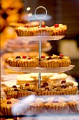 Cherry frangipane cakes in the window of a bakery