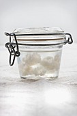 Kefir grains in a closed glass container of water