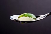 A Mojito bubble on a spoon (close-up)