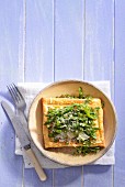 A puff pastry tart with goat's cheese and asparagus