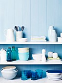 Kitchen shelves of crockery & utensils in shades of blue & white