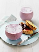Berry smoothies with banana served with toast and jam