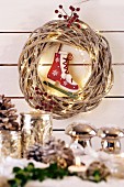 Wicker wreath with fairy lights and ice skate bauble