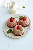 Chocolate cream cakes with raspberries