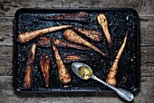 Roasted parsnips on a baking tray