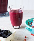 Sultans Delight: a smoothie made with berries and pomegranate seeds
