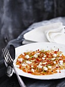 Salmon carpaccio with bean sprouts, chilli, lime zest and apple