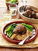 Marinated leg of lamb with green vegetables on a bed of millet risotto