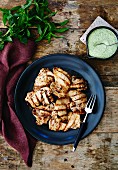 Grilled chicken legs with a mint and yoghurt sauce