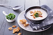 Creamy cheese soup with croutons