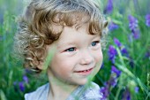 Portrait of a young boy looking away smiling