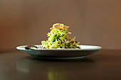Salad with pine nuts and fried onions