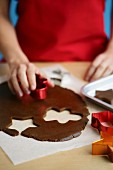 Gingerbread biscuits being cut out