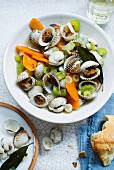Cockles in a vegetable broth with carrots and celery