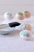 Decorating Easter eggs with botanical patterns using decoupage technique