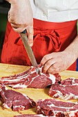 A butcher chopping meat
