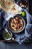 Chicken in a cashew nuts curry sauce with naan bread and coriander pesto
