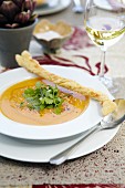 Pumpkin soup with a cheese stick