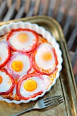 Fried eggs in tomato slices