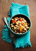 Couscous with chickpeas, read peppers, raisins, dried apricots, cinnamon and star anise (Morocco)