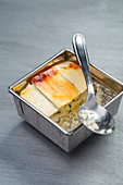 Goat's cheese and courgette terrine in a metal container