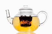 Tea in a glass teapot with a filter
