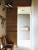 Wooden chairs in foyer of minimalist house