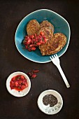 Heart-shaped pancakes with chia seeds and tomato salsa