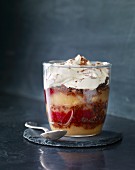 A layered dessert made with large strawberries, vanilla cream and whipped cream