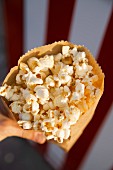 A paper bag full of popcorn