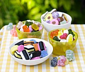 Four bowls of colourful sweets