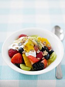 Fruit salad with yoghurt and maple syrup