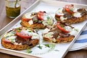 Spaghetti pizzas topped with mushrooms and mozzarella