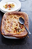 Root vegetables with gammon with a puff pastry topping
